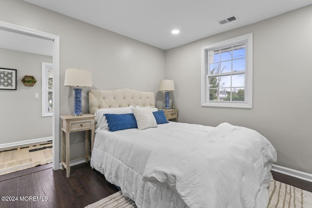 bedroom featuring dark hardwood / wood-style flooring