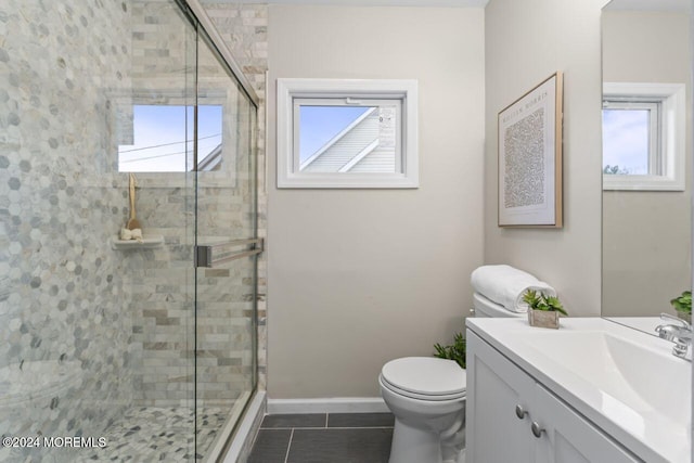 bathroom featuring tile patterned floors, toilet, an enclosed shower, and vanity