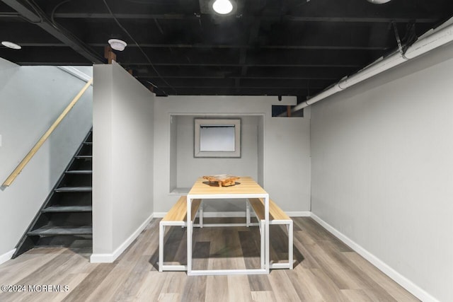 basement featuring wood-type flooring