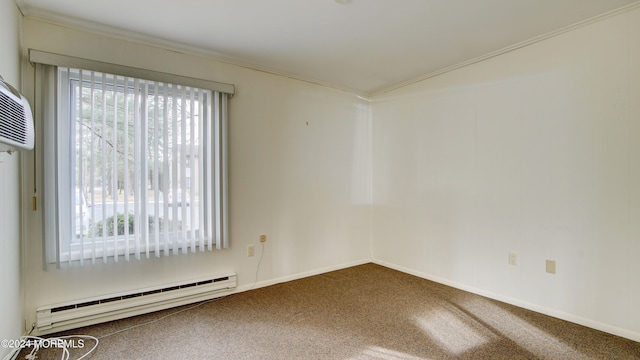 spare room with carpet floors, ornamental molding, and a baseboard heating unit