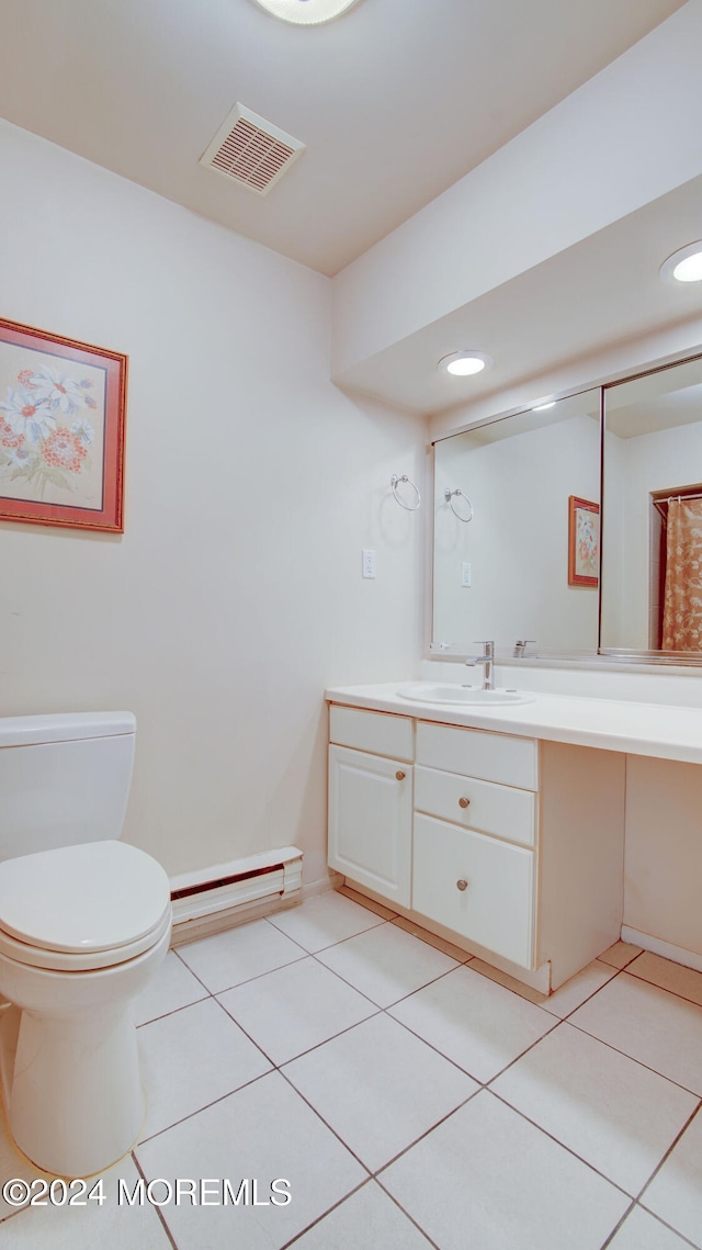 bathroom featuring tile patterned floors, toilet, vanity, and a baseboard heating unit