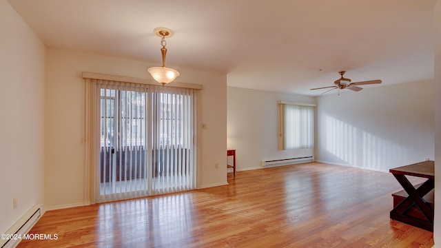 empty room with ceiling fan, light hardwood / wood-style floors, and a baseboard radiator