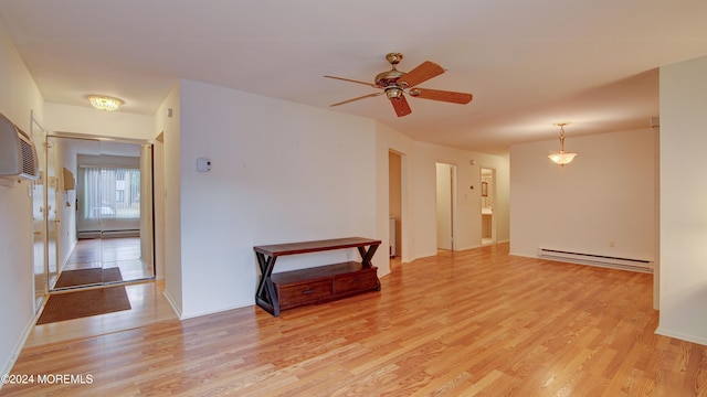 unfurnished room with ceiling fan, light hardwood / wood-style floors, and a baseboard radiator