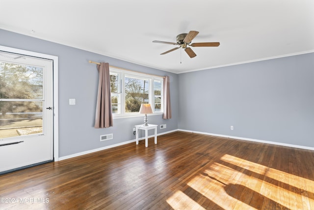 unfurnished room with crown molding, ceiling fan, and dark hardwood / wood-style floors