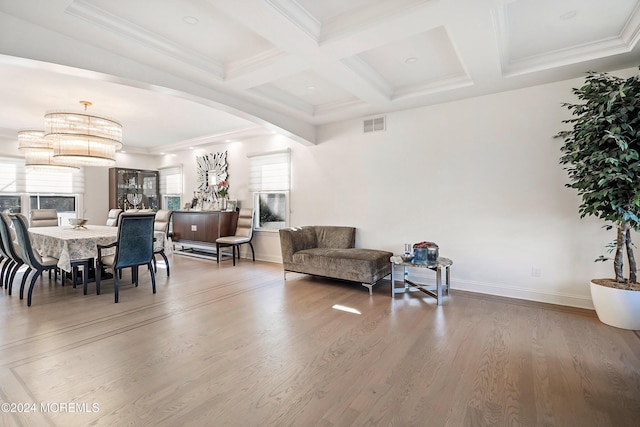 interior space with coffered ceiling, beamed ceiling, a notable chandelier, crown molding, and wood-type flooring