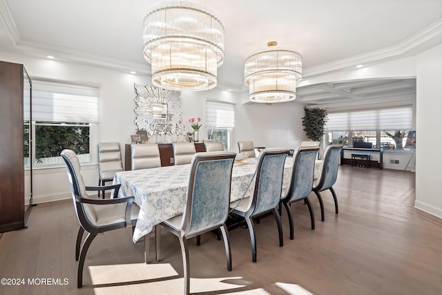 dining room featuring ornamental molding, dark hardwood / wood-style flooring, and a notable chandelier