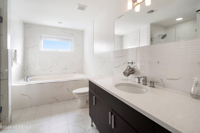 full bathroom featuring vanity, backsplash, toilet, shower with separate bathtub, and tile walls