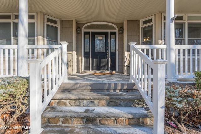 entrance to property featuring covered porch