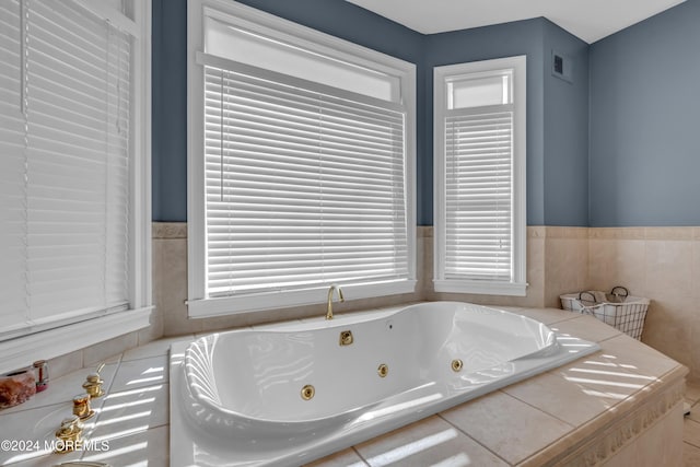 bathroom with tiled tub