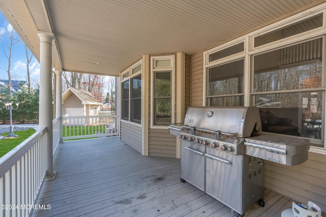 deck with a porch and grilling area