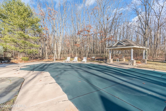 view of pool featuring a gazebo and a patio area