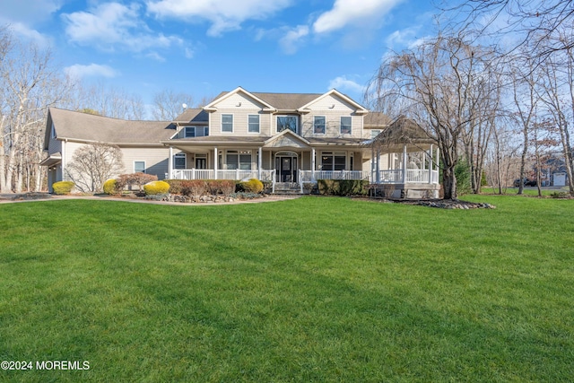 view of front facade featuring a front yard and a porch