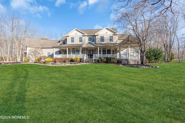 view of front of house with a porch and a front lawn