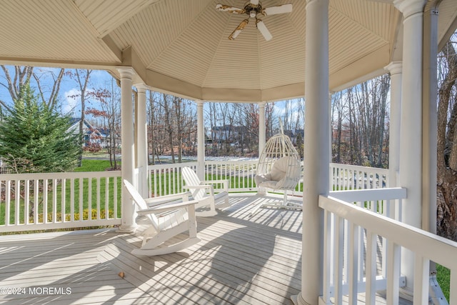 deck featuring covered porch and ceiling fan