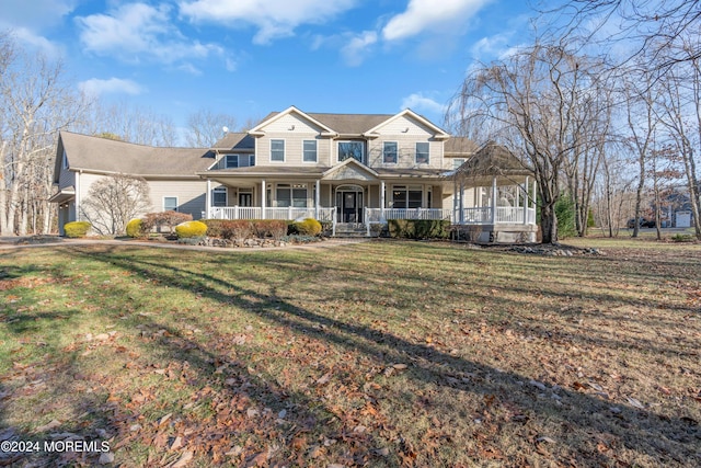 view of front of house with a front lawn and covered porch