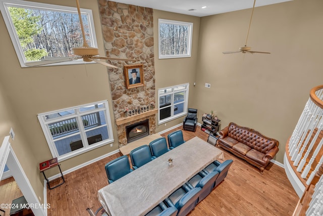 living room with a fireplace, hardwood / wood-style flooring, and a wealth of natural light