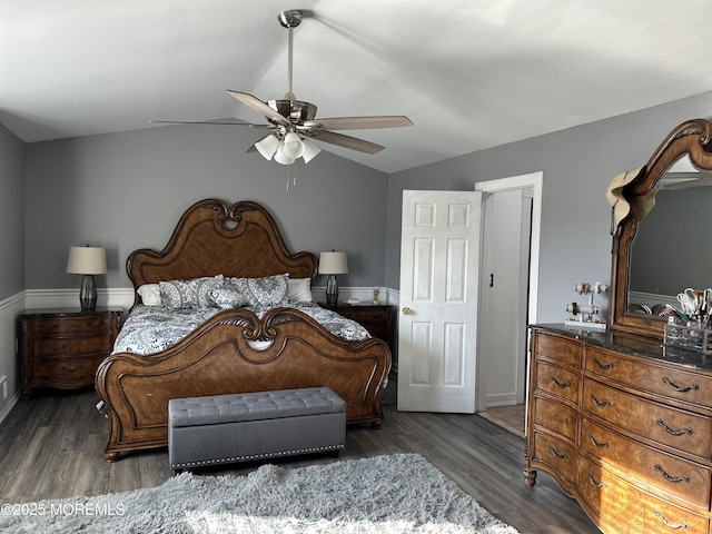 bedroom with dark wood-type flooring, ceiling fan, and lofted ceiling