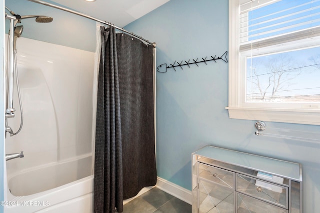 bathroom with tile patterned floors and shower / bath combo with shower curtain