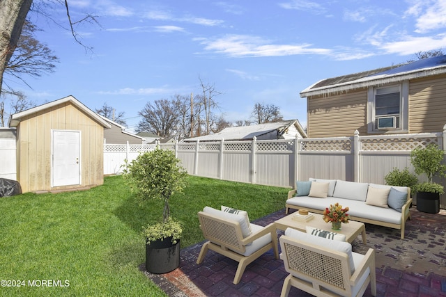 view of yard featuring a storage shed, an outdoor hangout area, and a patio