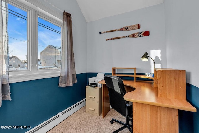 home office featuring a baseboard radiator and lofted ceiling