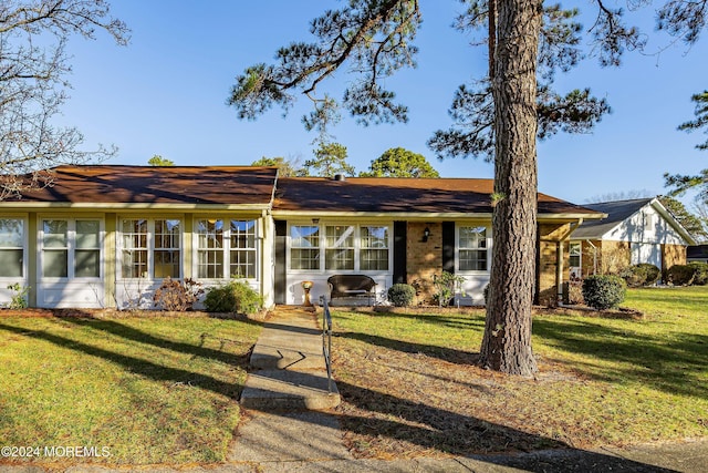 ranch-style house with a front yard