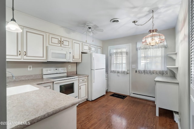 kitchen with white appliances, baseboard heating, sink, dark hardwood / wood-style floors, and hanging light fixtures