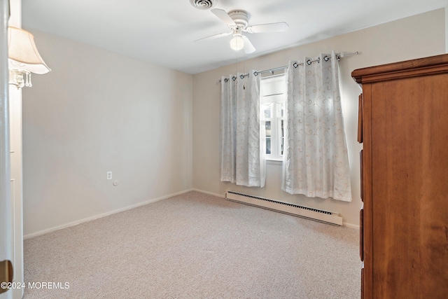 unfurnished room with a baseboard radiator, ceiling fan, and light colored carpet