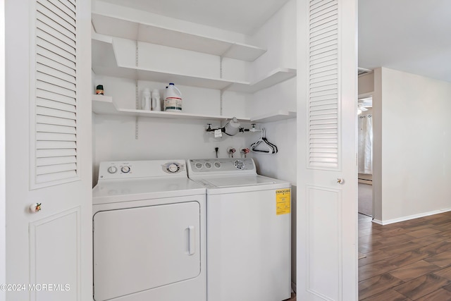 clothes washing area with baseboard heating, separate washer and dryer, and dark wood-type flooring