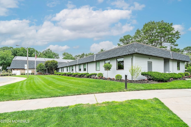 view of side of home featuring a lawn