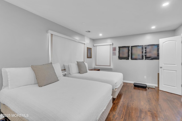 bedroom featuring dark hardwood / wood-style floors