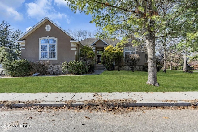 view of front of home with a front yard