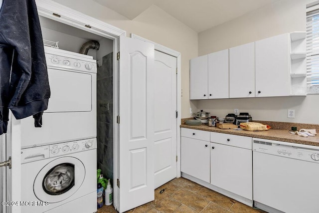 washroom with stacked washing maching and dryer