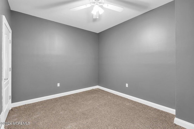 unfurnished room with carpet and ceiling fan