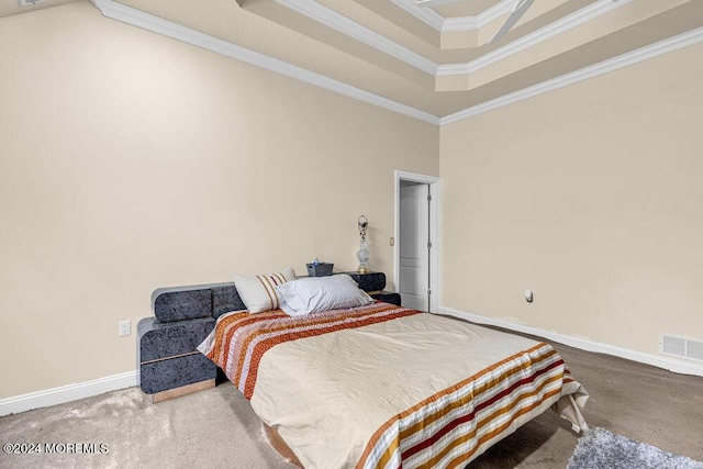 carpeted bedroom featuring a towering ceiling, a tray ceiling, and crown molding