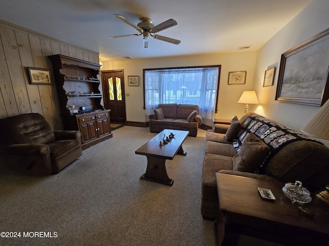 carpeted living room featuring visible vents and ceiling fan