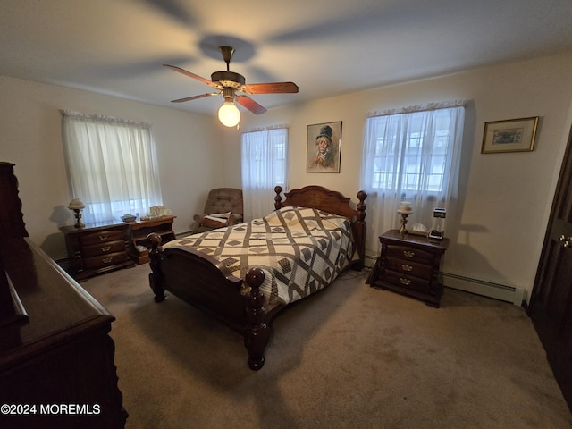 bedroom with a baseboard heating unit, carpet flooring, and a ceiling fan