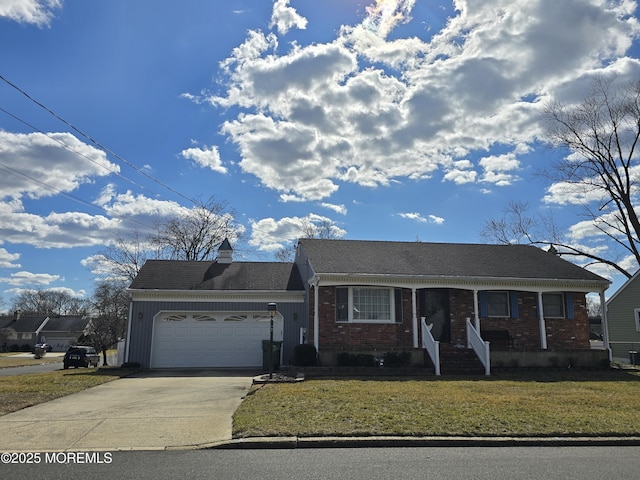 view of front of property featuring a front lawn, concrete driveway, a garage, brick siding, and a chimney