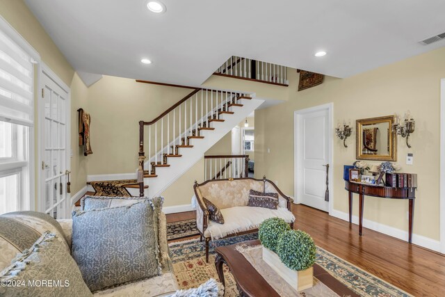 living room featuring wood-type flooring and french doors