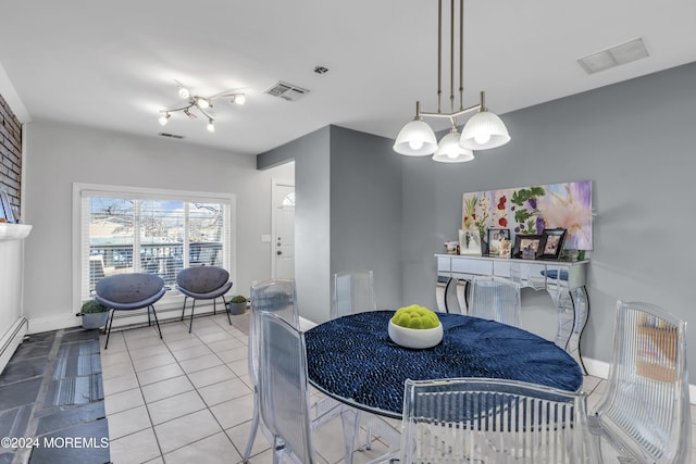 tiled dining space with a chandelier and a baseboard radiator