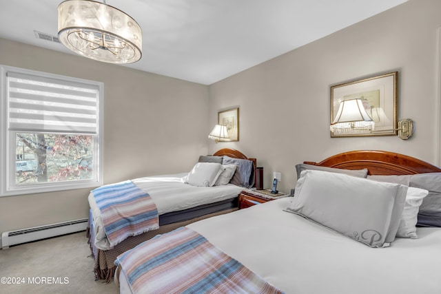 carpeted bedroom with a chandelier and baseboard heating