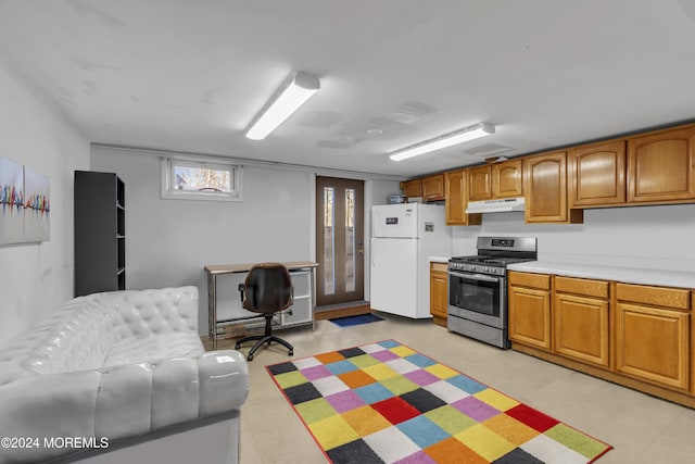 kitchen with white fridge and stainless steel gas range oven