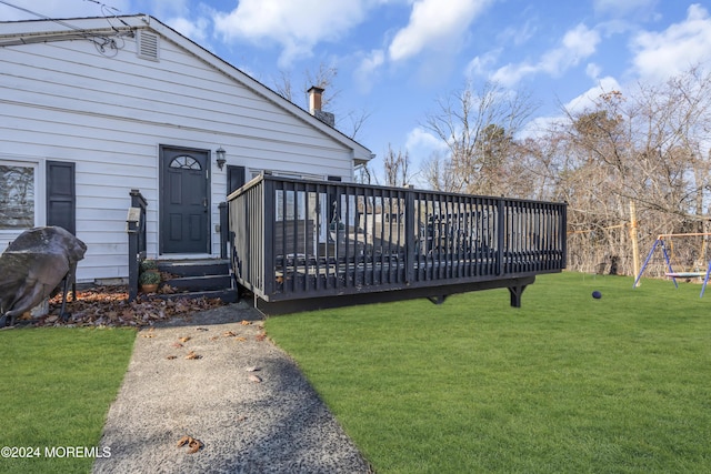 wooden terrace with a yard