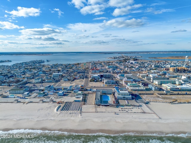 aerial view with a water view and a view of the beach