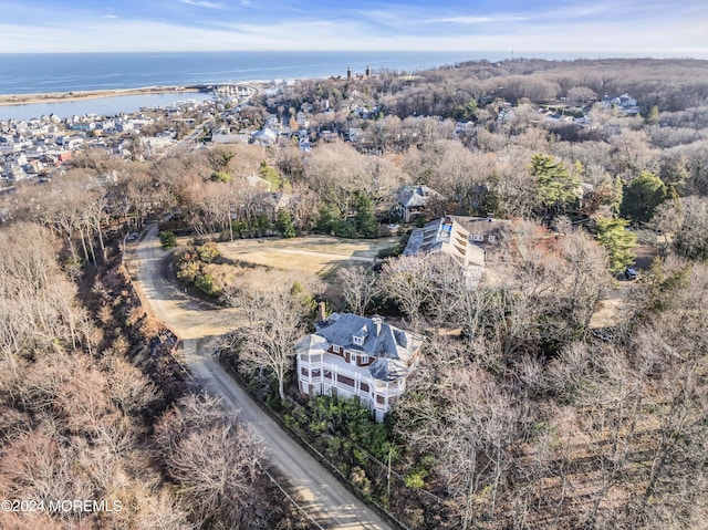 birds eye view of property featuring a water view