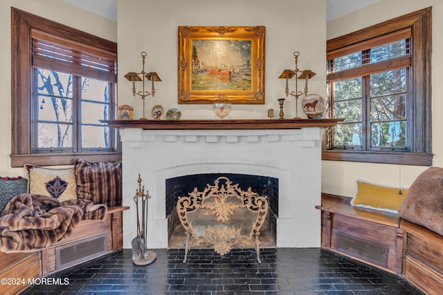 room details featuring visible vents and a fireplace