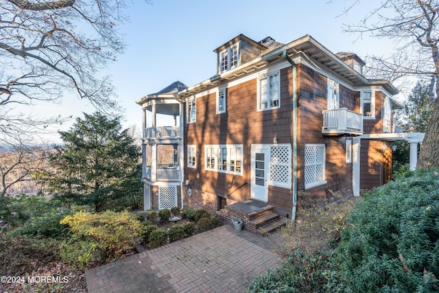 view of property exterior featuring a balcony