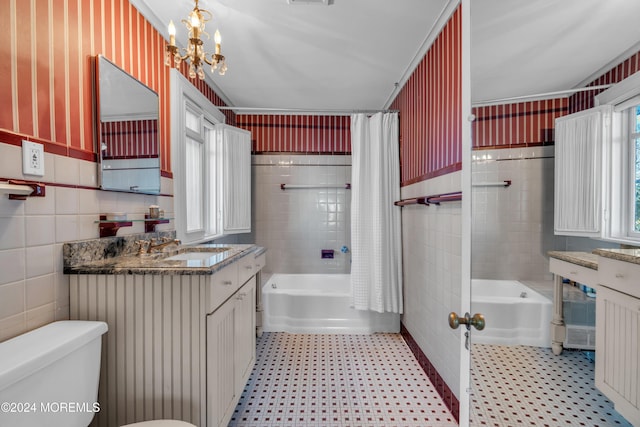 full bathroom featuring tile patterned floors, toilet, tile walls, and shower / bath combo