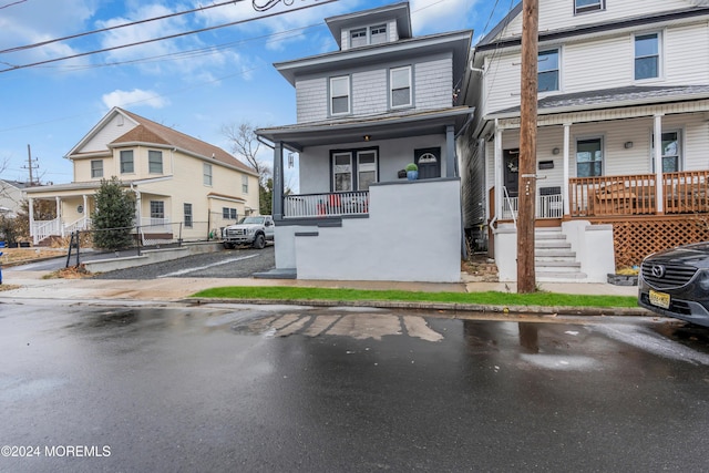 townhome / multi-family property with a porch