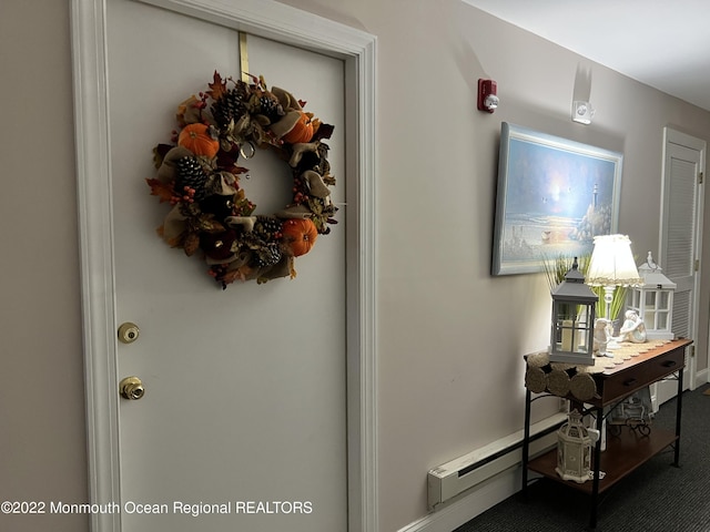 interior space featuring baseboard heating