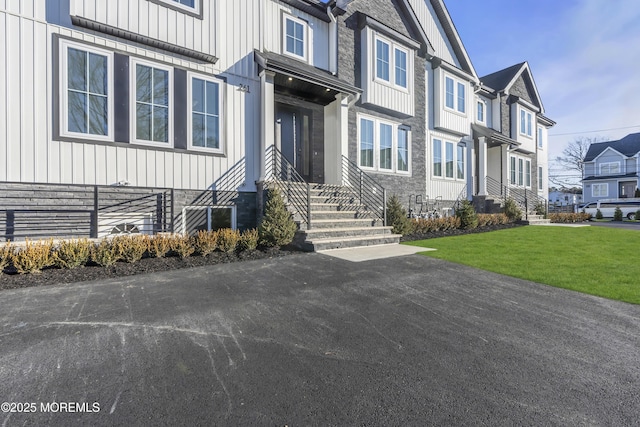 entrance to property with a yard